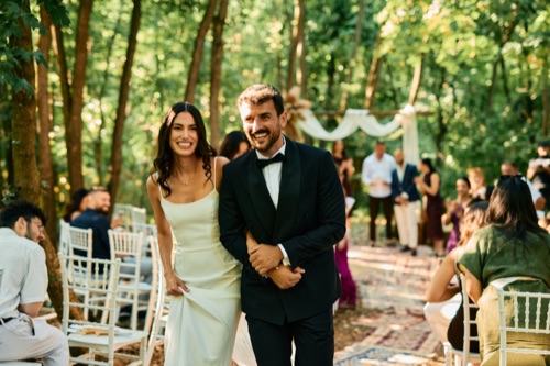 Wedding couple standing beside an RV
